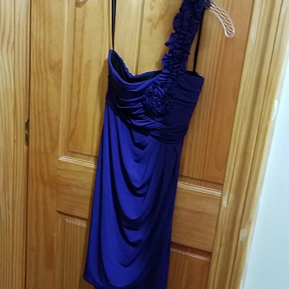 Off the shoulder purple dress.